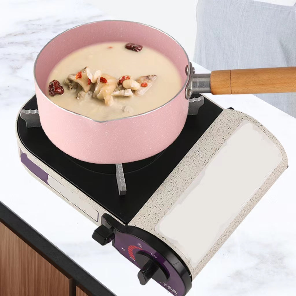 Mini outdoor calf-type gas stove with flames, perfect for outdoor cooking and gatherings.